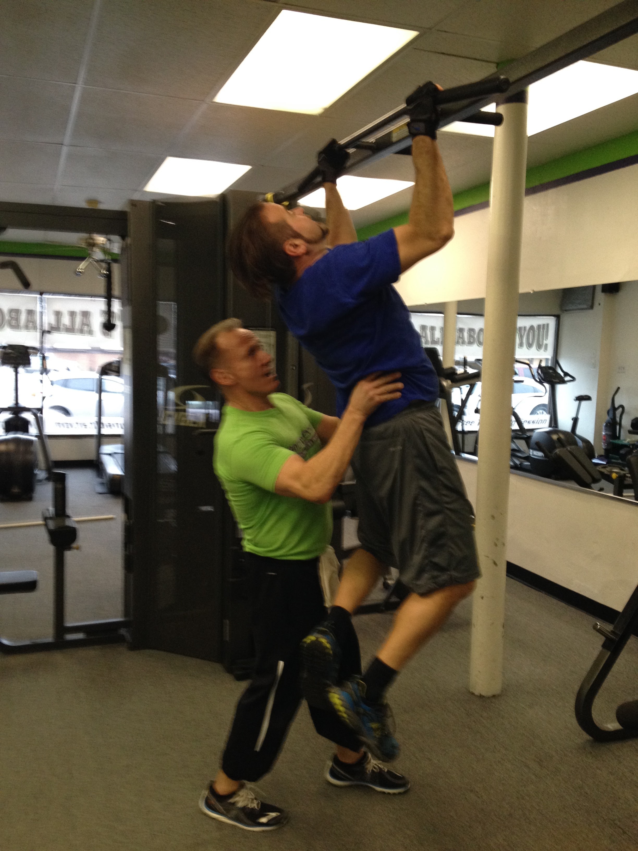 Dom assisting Neal with a pull up